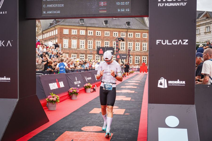 Nick running to the Ironman finish line